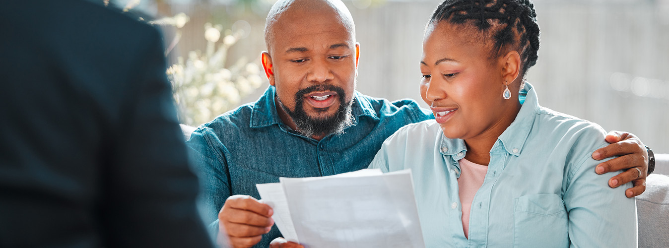 Man and woman sitting reviewing papers